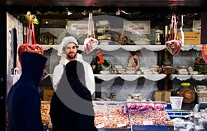 EDINBURGH, SCOTLAND, UK Ã¢â¬â December 08, 2014 - Young couple looking at food stall at Edinburgh german christmas market